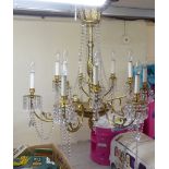 A modern cast gilt metal twelve branch chandelier with glass glass pendants  28"drop  32"dia