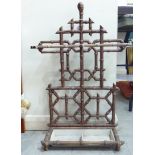 A 19thC cast iron and enamelled, simulated bamboo stickstand  30"h  19"w