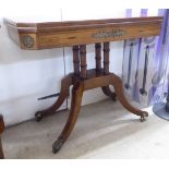 An early Victorian mahogany card table, the rotating foldover top raised on four pillar supports,