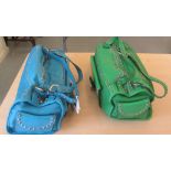 Two similar Zuella stitched and stud upholstered hide bags, one in blue, the other green