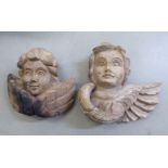 Two vintage carved wooden cherubs' head papier mache moulds  largest 7"h