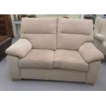 A modern two person settee, upholstered in textured effect biscuit coloured fabric  60"w