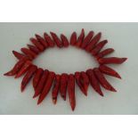 A red coral 'tooth' bead necklace