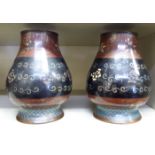 A pair of early 20thC cloisonné vases of waisted, baluster form, variously decorated in colours