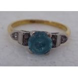 An 18ct gold blue zircon and diamond set ring
