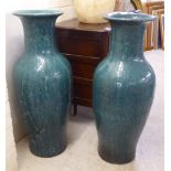 A pair of modern Chinese inspired crackle glazed pottery floor standing vases of tapered, waisted