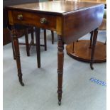 A George III mahogany Pembroke table, raised on ring turned legs and casters  28"h  30"w