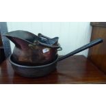 A late 19thC copper preserve pan with a rolled lip and a rivetted, tapered hollow handle  14"dia;