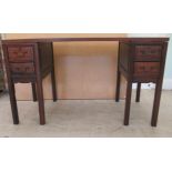 A 20thC Chinese mahogany desk with a platform top, on twin two drawer pedestals, raised on square