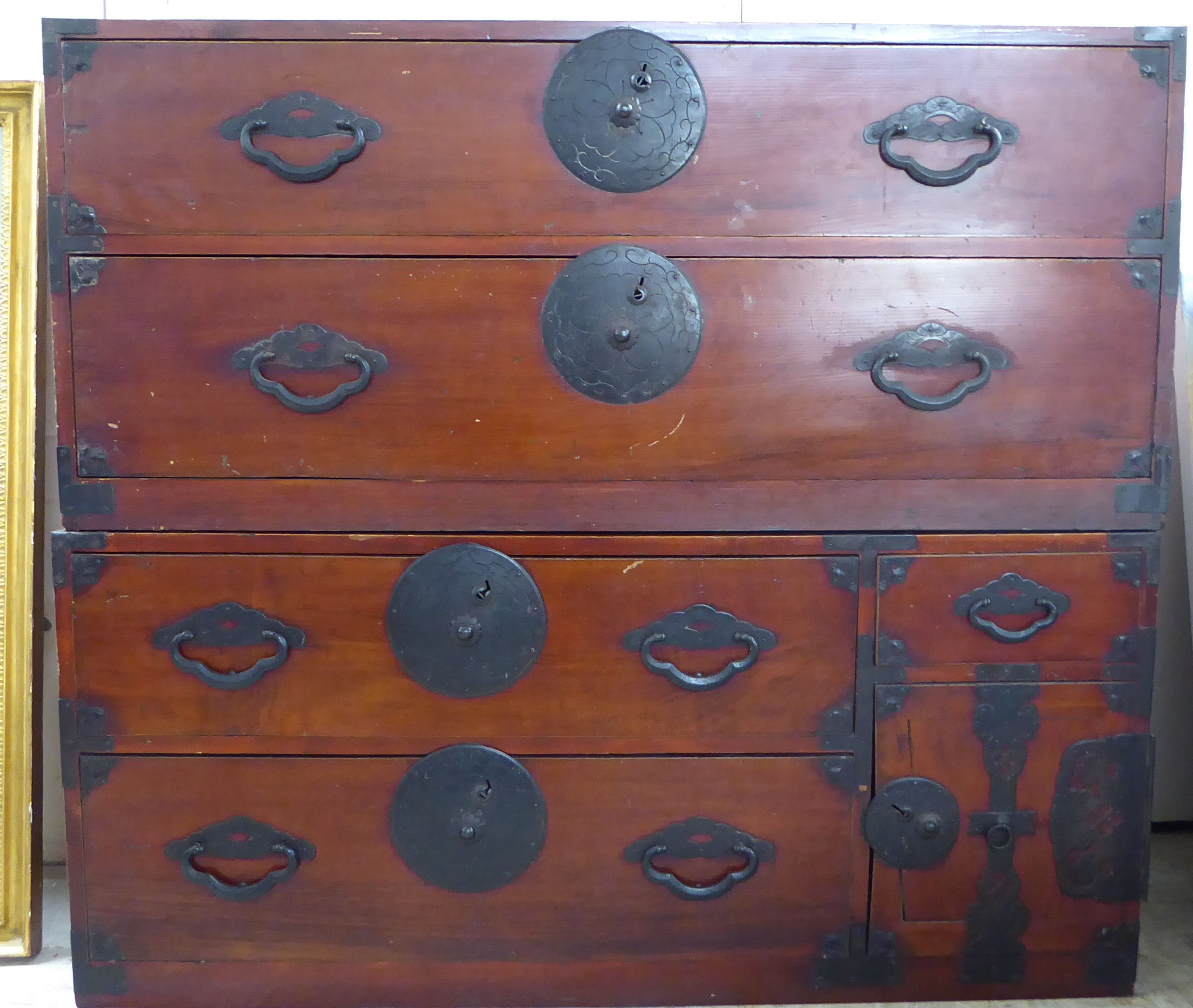 Two 20thC Chinese pine cabinets with an arrangement of drawers and doors, on a plinth, each 20"h