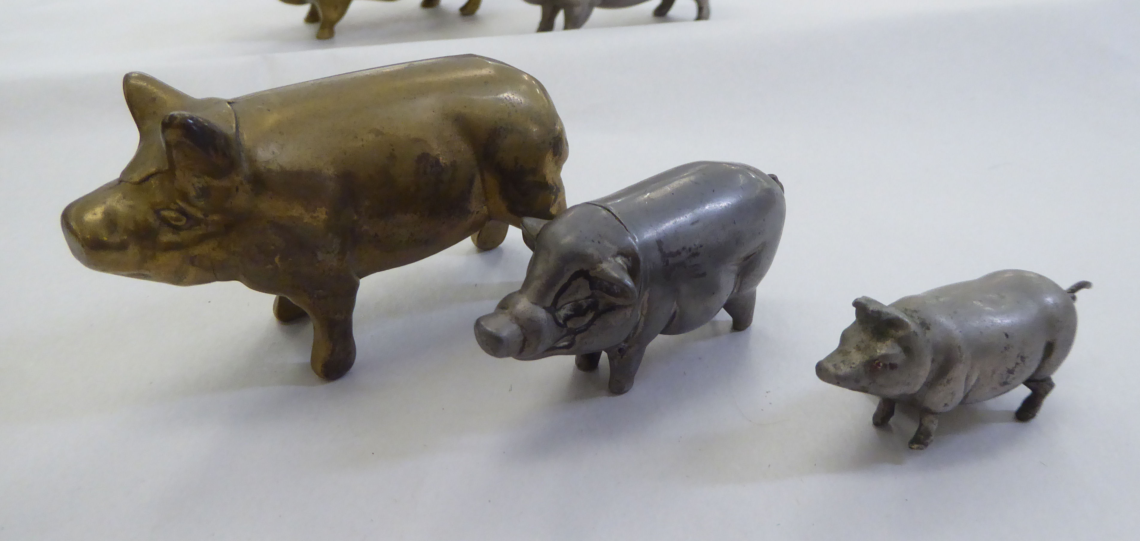 Six 20thC novelty pig themed items, viz. a measure, a vesta, a matchbox sleeve and others - Image 3 of 5