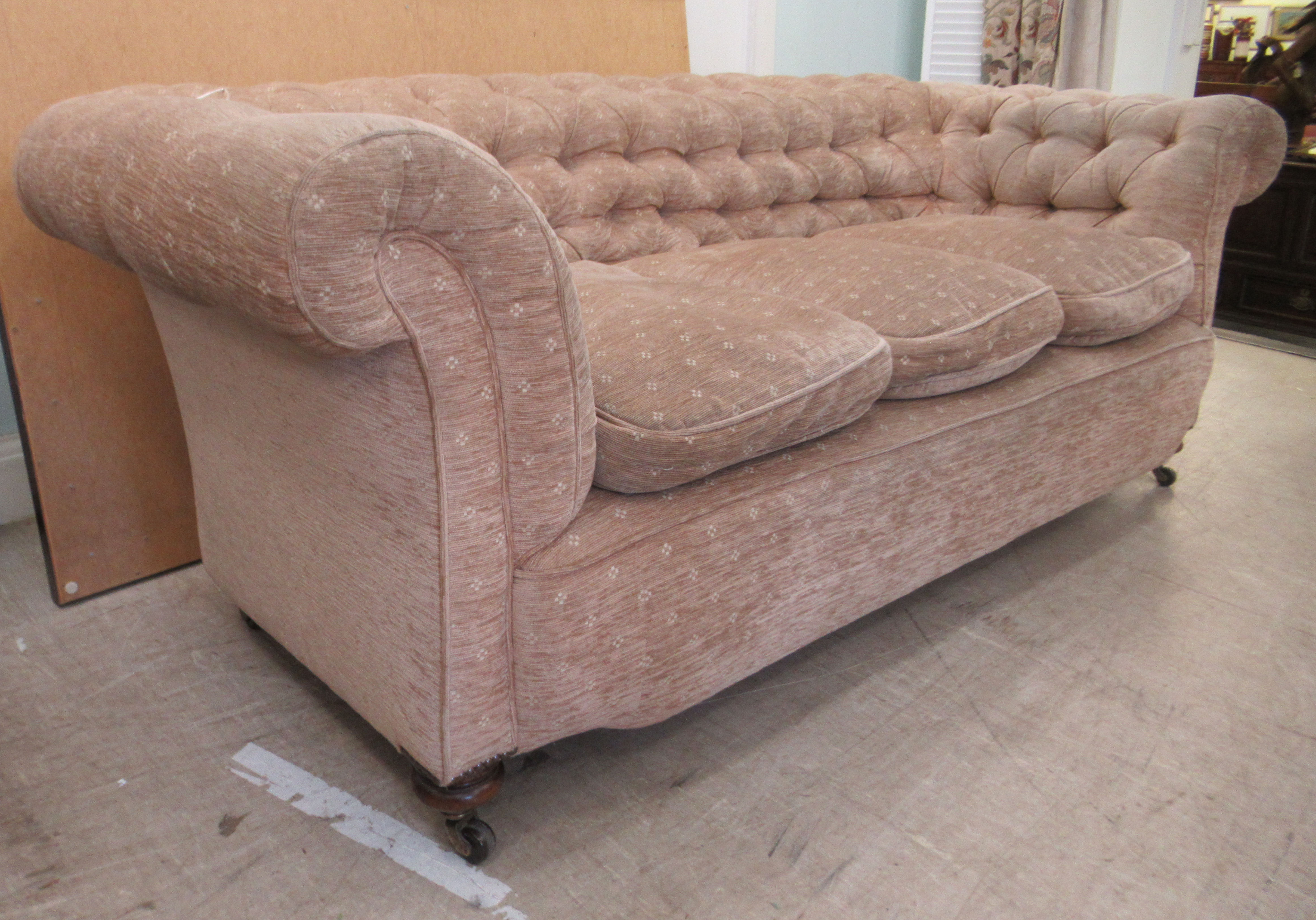 An early 20thC and later upholstered Chesterfield, raised on turned forelegs and casters  74"w - Image 3 of 5