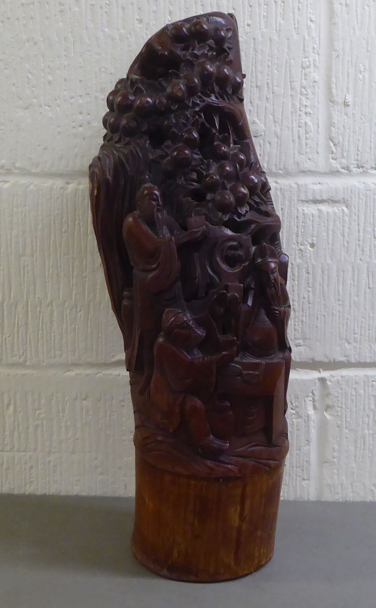 A 20thC Asian softwood carving, depicting figures presenting gifts  23"h