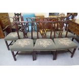 A set of seven George III Chippendale design pierced splat back mahogany framed dining chairs with a