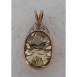 A 9ct gold pendant, set with an oval cut labradorite and diamonds