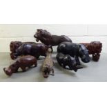 Carved wooden model animals: to include lions, hippos and rhinos  largest 11"h