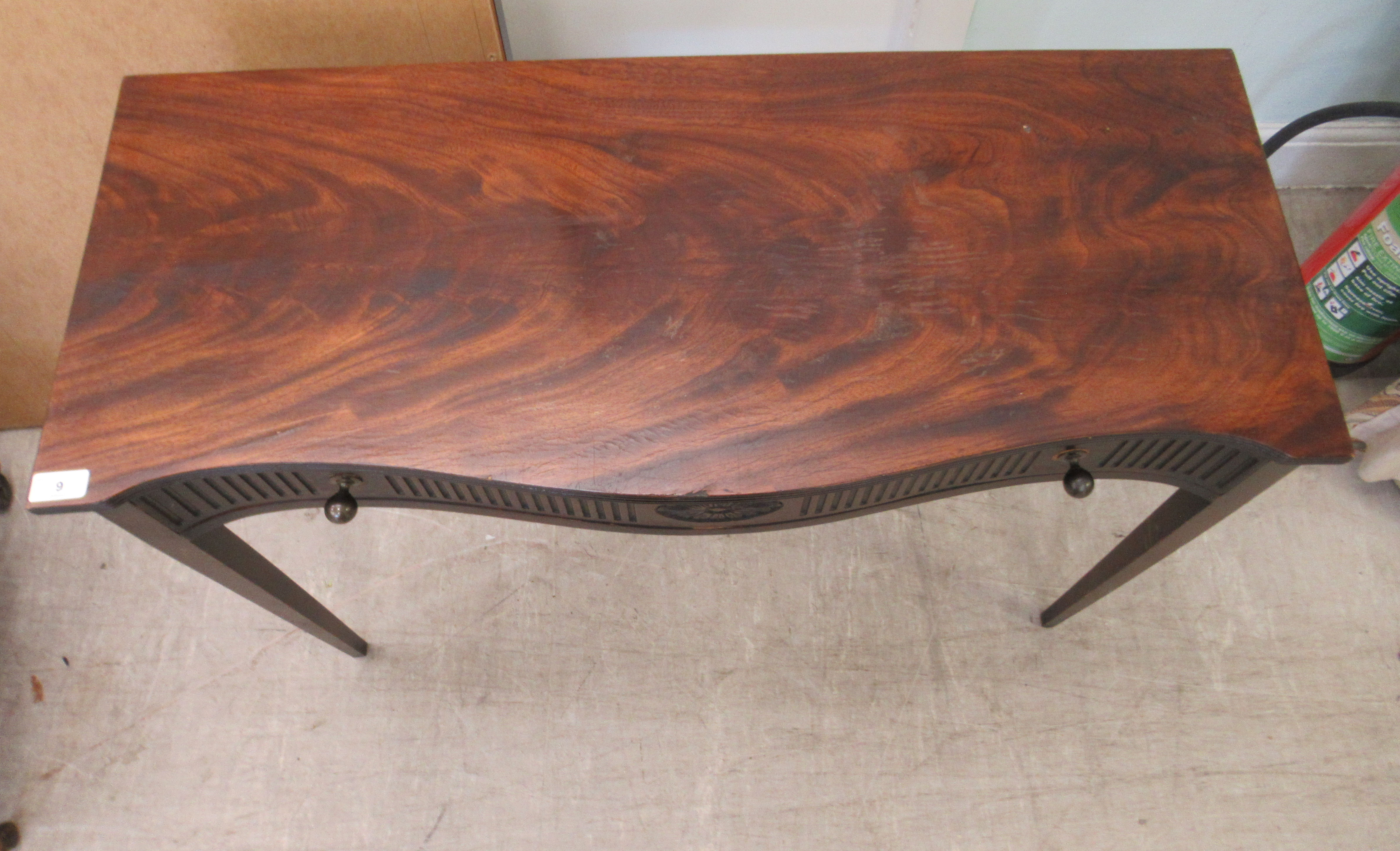 An early 20thC mahogany veneered serpentine front single drawer side table, raised on square, - Image 2 of 5