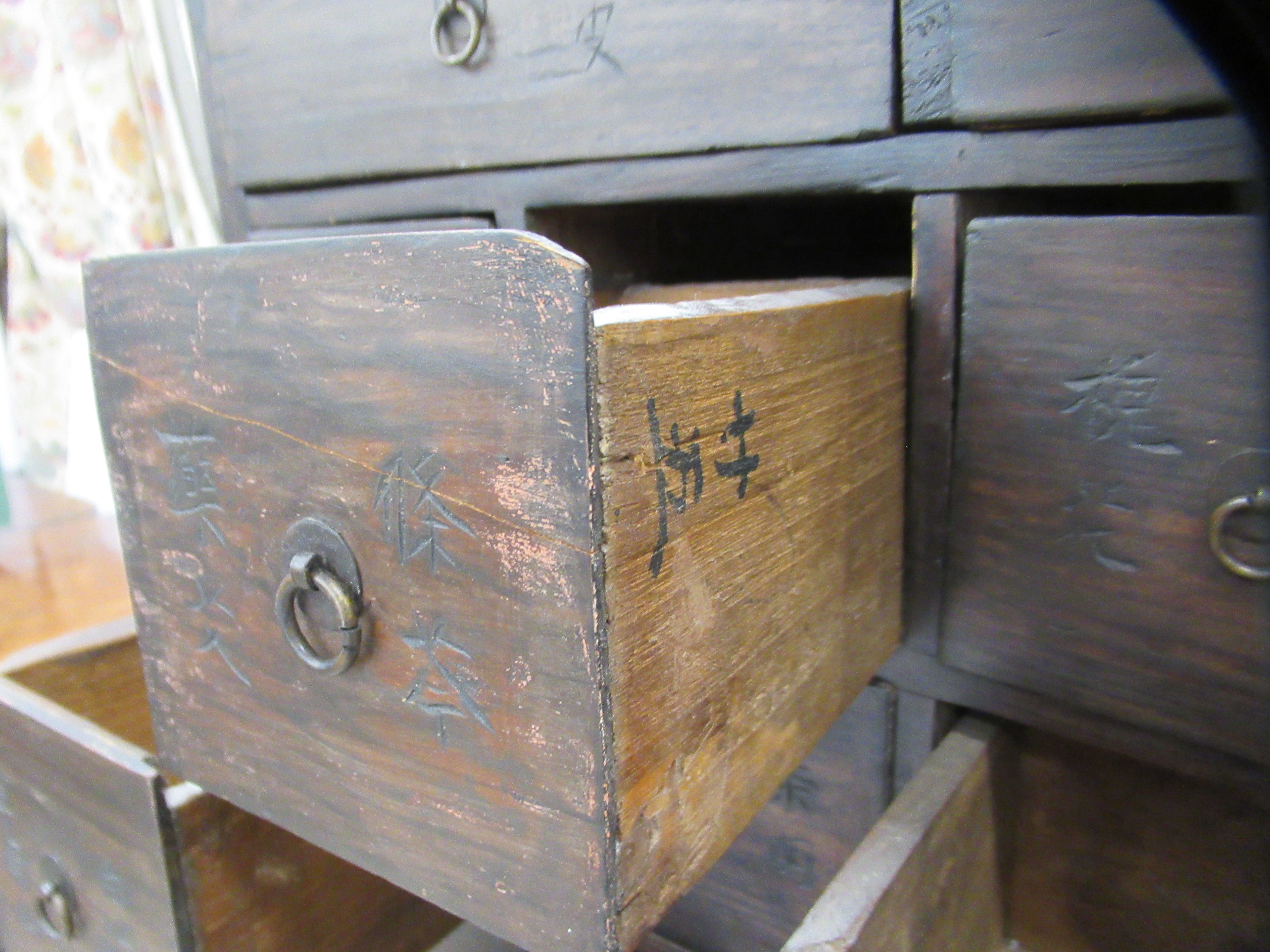 A 20thC Chinese stained pine medicine cabinet with an arrangement of fifty-two drawers, over a - Image 7 of 10