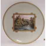 A Davenport Longport celadon coloured and gilded porcelain plate, decorated with a vignette