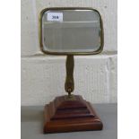 A late 19thC dressing mirror, the brass mounted plate on two adjustable pins  stamped Stadium Reg
