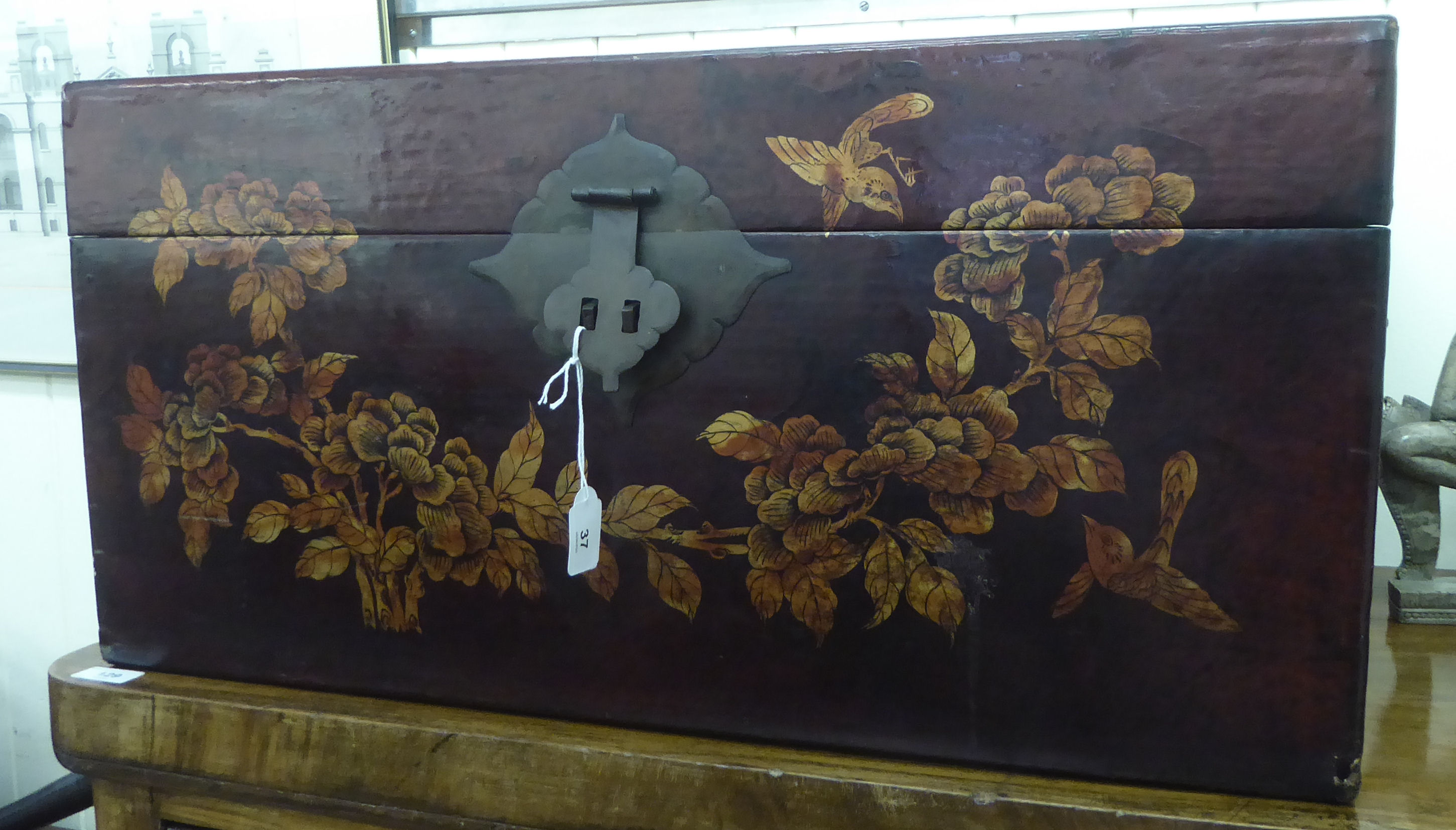 A 20thC Chinese painted blanket chest with straight sides and a hinged lid, on a plinth  14"h  27"w