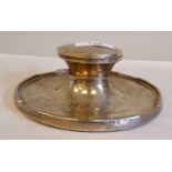 An early 20thC loaded silver capstan design inkwell with a hinged cap  marks rubbed but