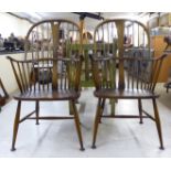 A pair of Ercol dark stained beech and elm framed 'The Chairmakers' Windsor chairs