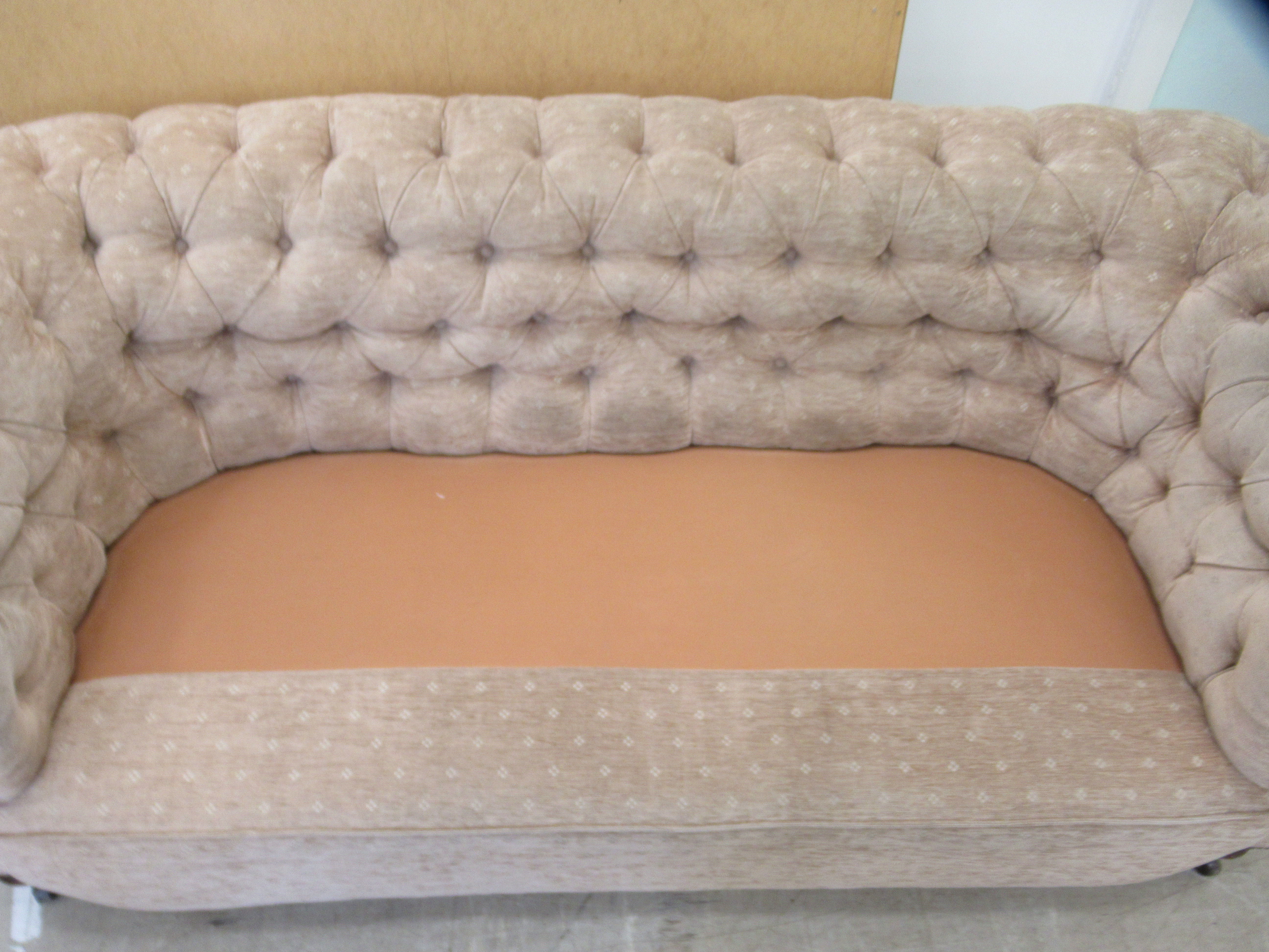 An early 20thC and later upholstered Chesterfield, raised on turned forelegs and casters  74"w - Image 5 of 5