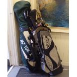 Two golf bags and a miscellany of woods and irons