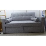 A modern two seater sofa bed, upholstered in two tone grey patterned fabric  65"w