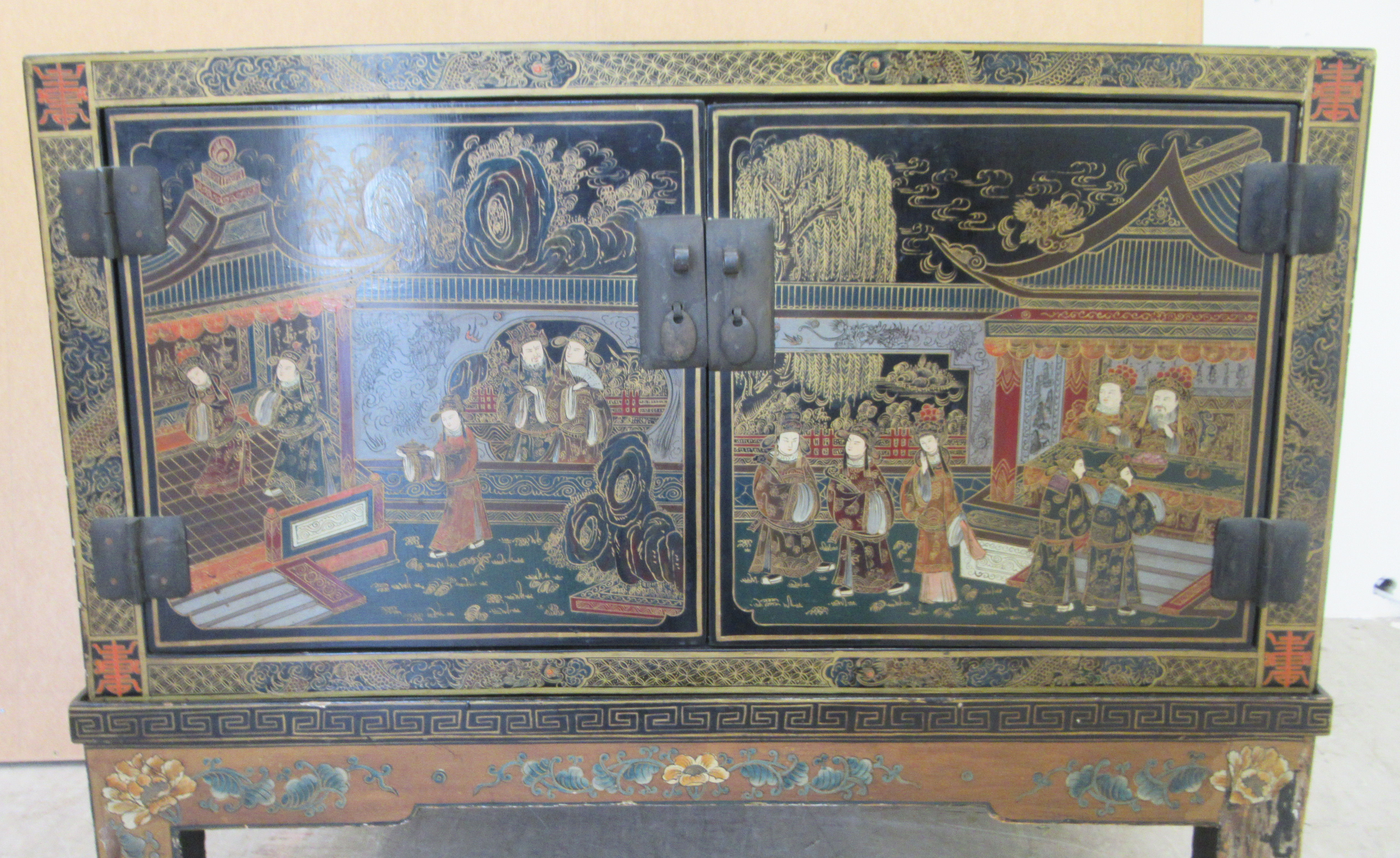 A 20thC Japanese black lacquered low cabinet on stand with two doors, decorated with traditional - Image 4 of 6