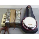 Two musical instruments, viz. a Mastertone eight key piano accordion, in a marble effect case; and a