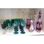Art glass: to include a clear and cranberry coloured decanter and stopper, decorated with fruiting
