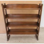 An early 20thC stained beech and oak four tier open front bookcase, on a plinth  39"h  35"w