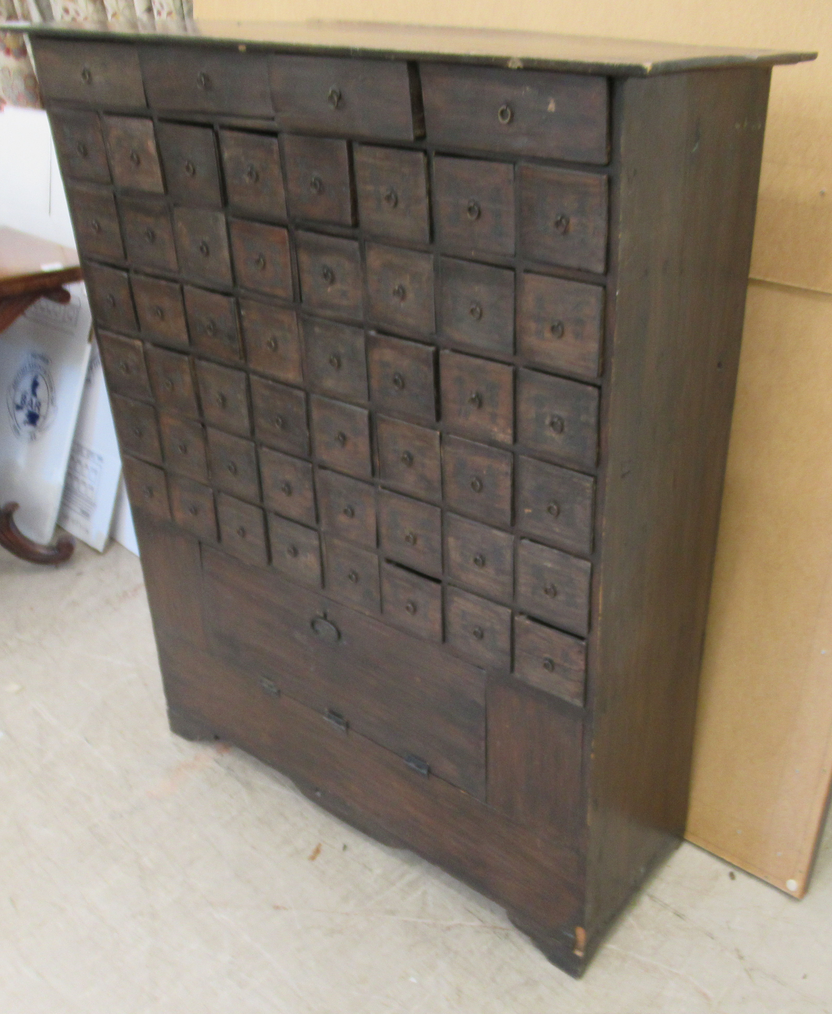 A 20thC Chinese stained pine medicine cabinet with an arrangement of fifty-two drawers, over a - Image 3 of 10