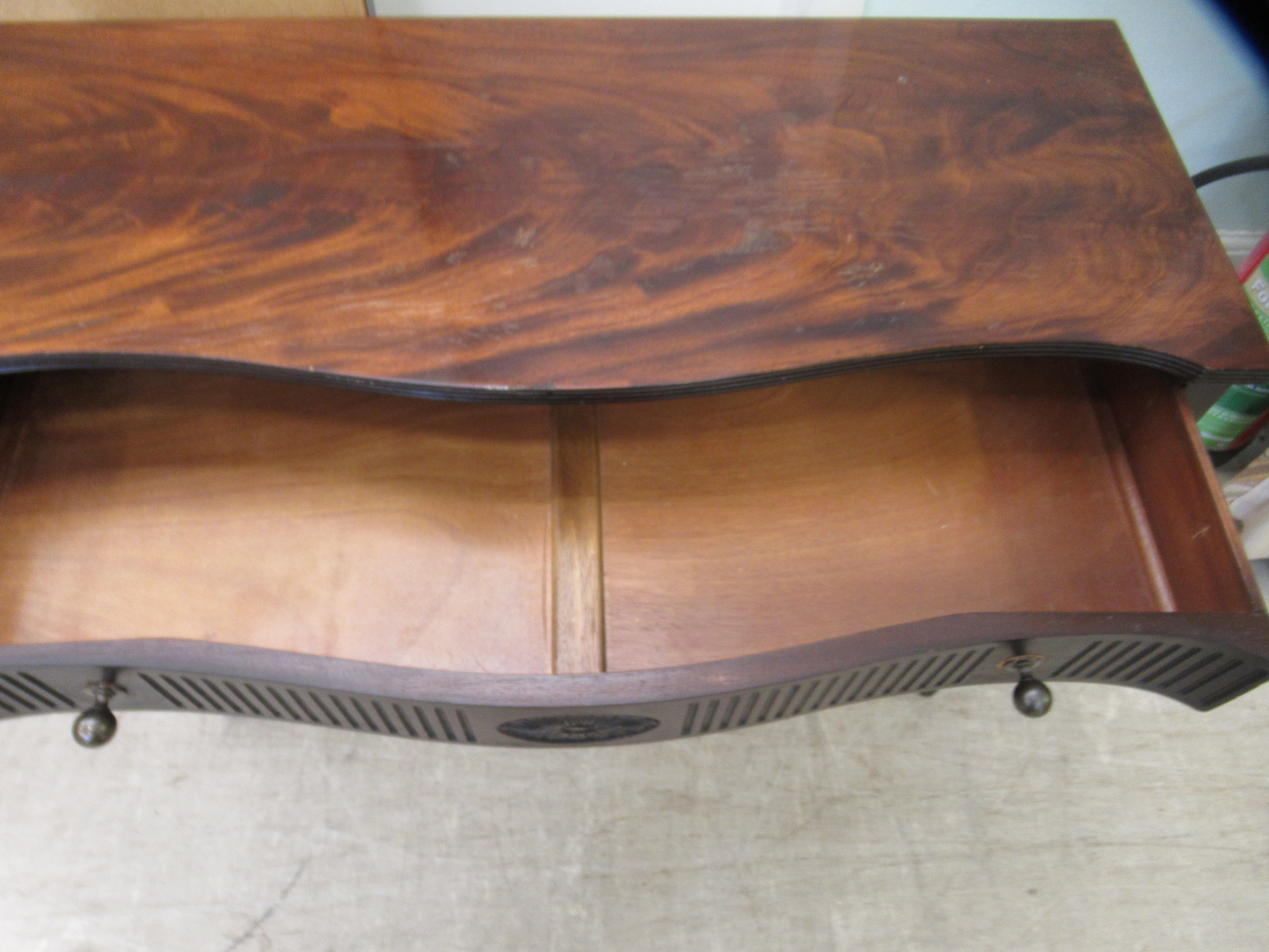 An early 20thC mahogany veneered serpentine front single drawer side table, raised on square, - Image 4 of 5