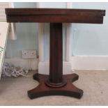 A Regency mahogany pedestal tea table with a rotating foldover top, on a splayed plinth  26"h  25"w