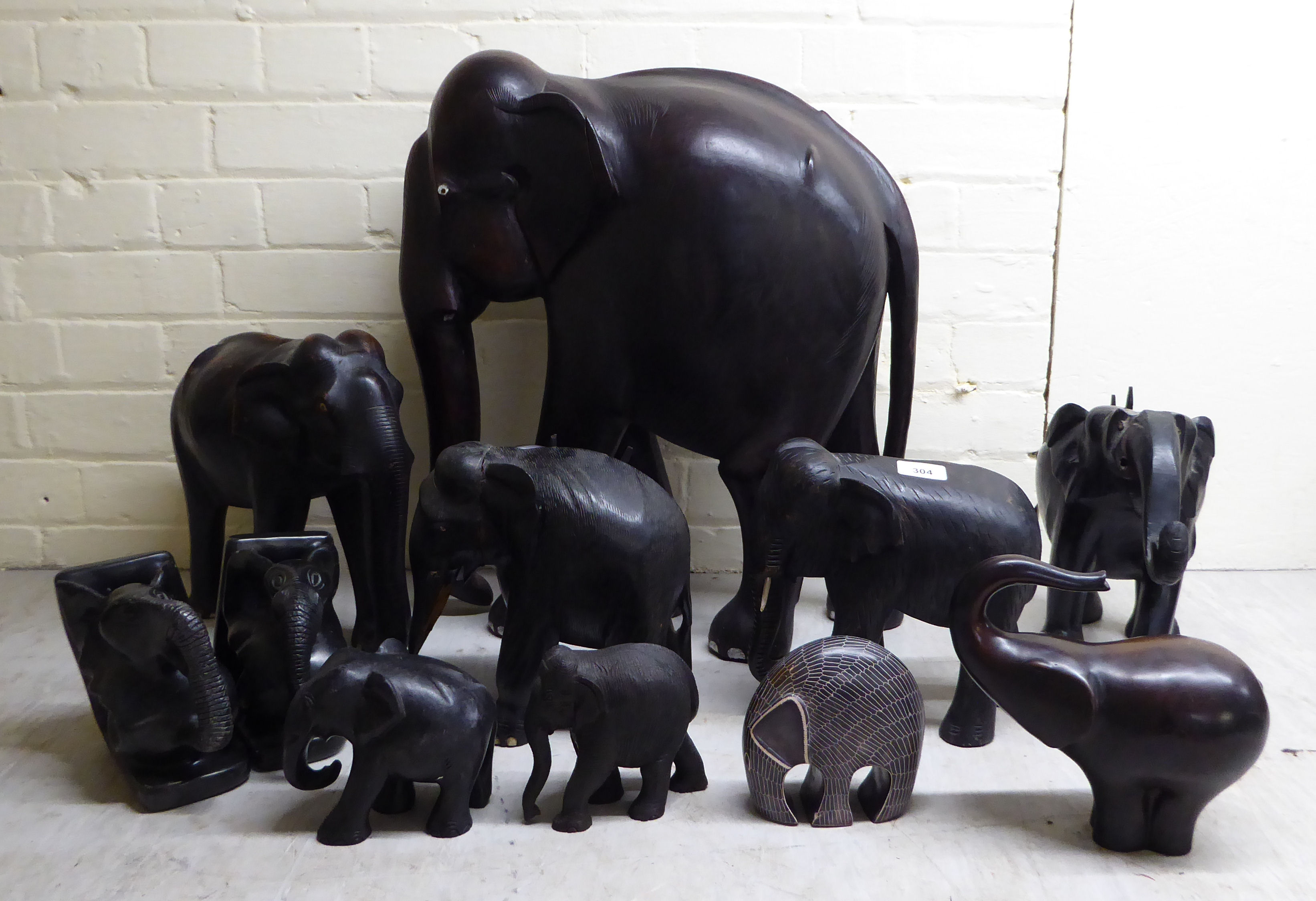 Elephant ornaments, mainly African carved wooden examples  largest 12"h