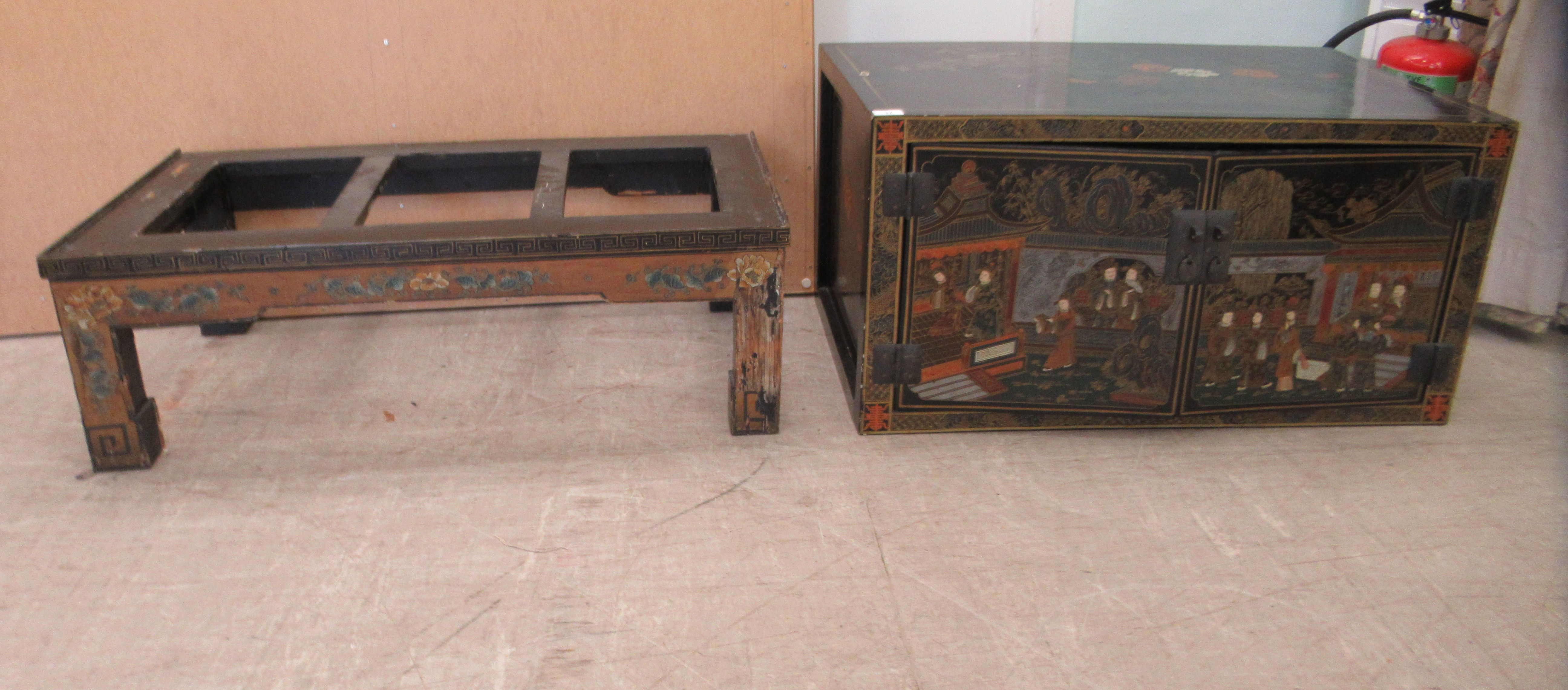 A 20thC Japanese black lacquered low cabinet on stand with two doors, decorated with traditional - Image 6 of 6