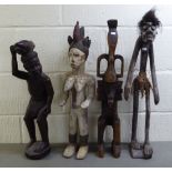 Four carved wooden tribal figures  largest 26"h