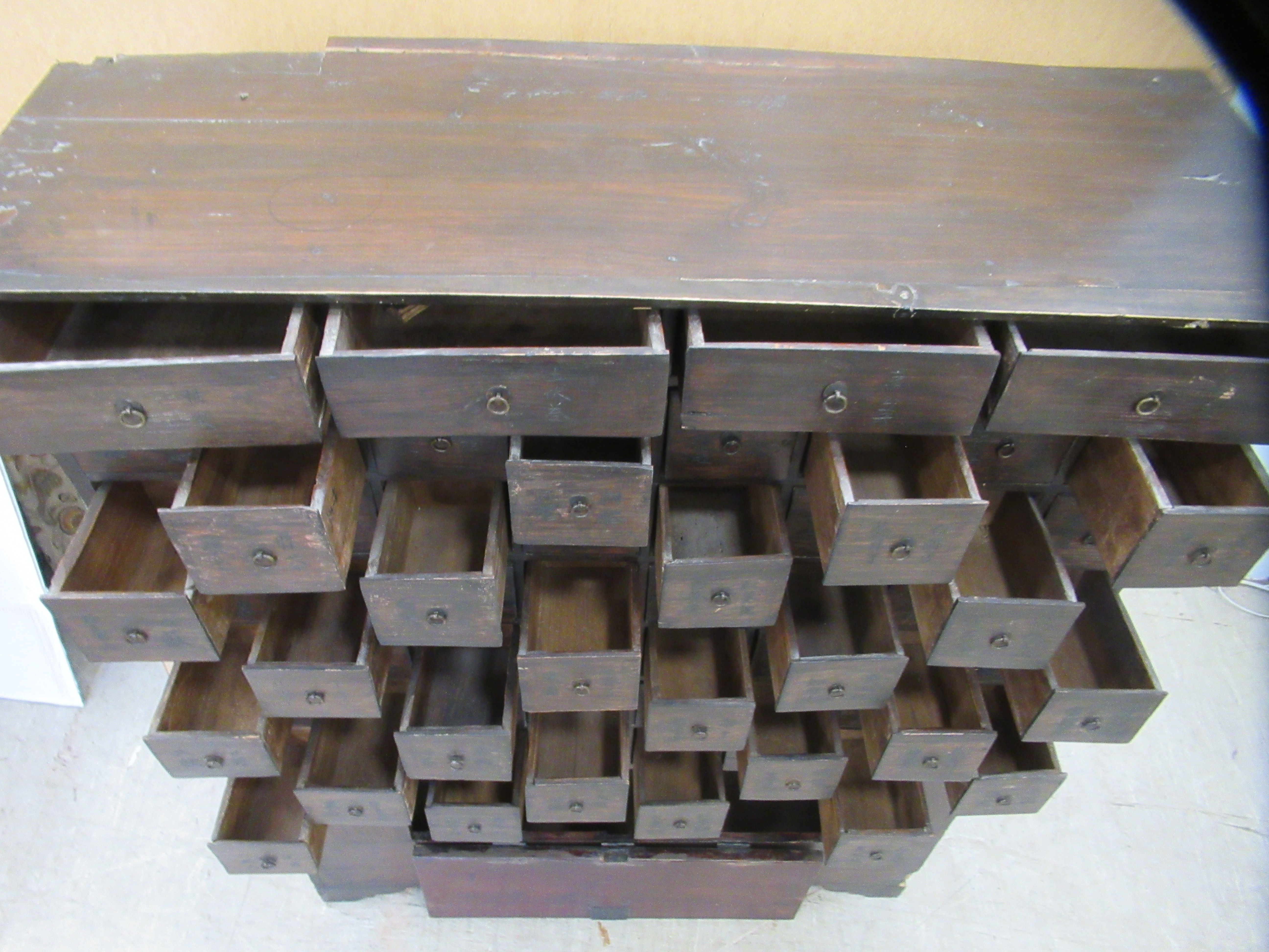 A 20thC Chinese stained pine medicine cabinet with an arrangement of fifty-two drawers, over a - Image 4 of 10