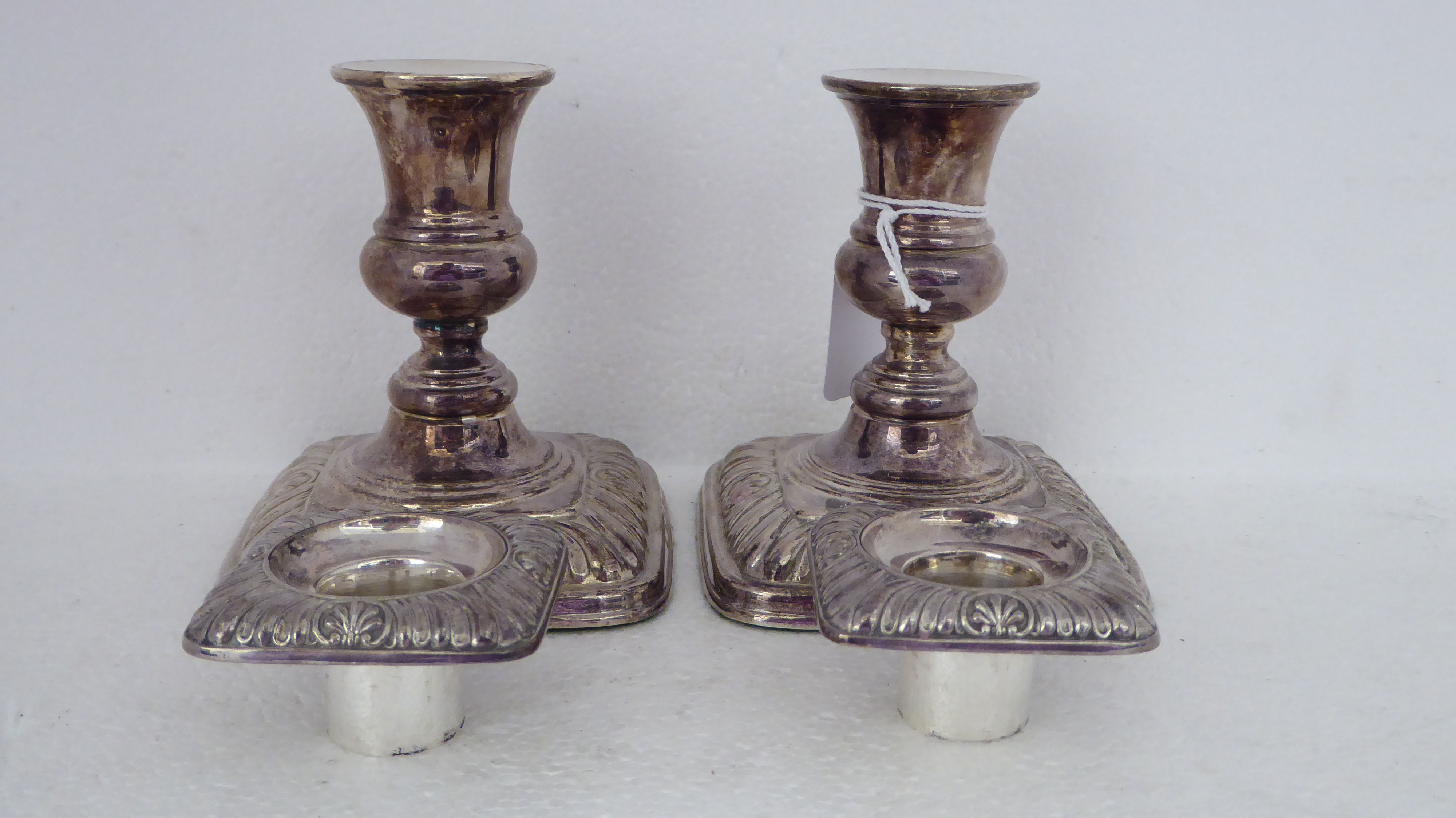 A pair of loaded silver candlesticks with embossed decoration  Birmingham 1987  4.5"h - Image 5 of 6