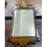 A Georgian mirror, in a fretworked mahogany frame with Ho-Ho bird ornament  30" x 18"