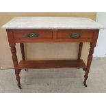 A late Victorian washstand with a marble top, over a mahogany underframe with two frieze drawers,