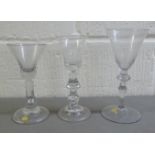 Three 19thC glass pedestal wine glasses  largest 7.25"h