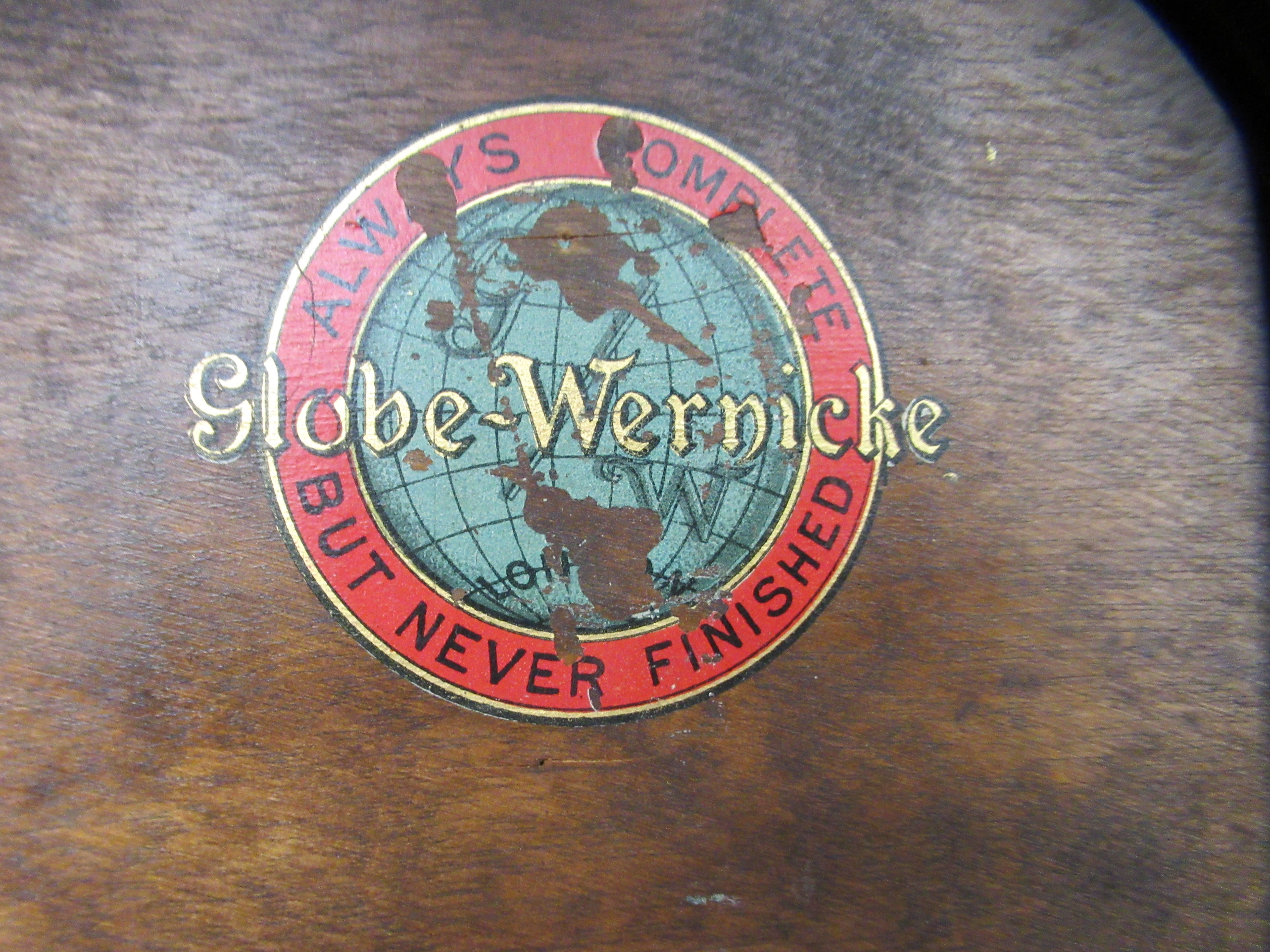 An early 20thC Globe Wernicke mahogany and glazed three section bookcase on stand, raised on - Image 5 of 5