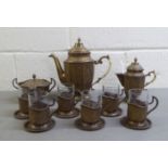 A late 19thC Persian ornately cast brass coffee set  comprising a coffee pot, cream jug, sugar basin