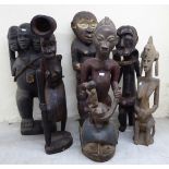 Six carved wooden tribal figures  largest 26"h