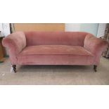 An Edwardian and later upholstered Chesterfield, raised on ring turned forelegs and casters  74"w,