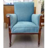 An Edwardian string inlaid mahogany and later pale blue fabric upholstered, enclosed armchair,